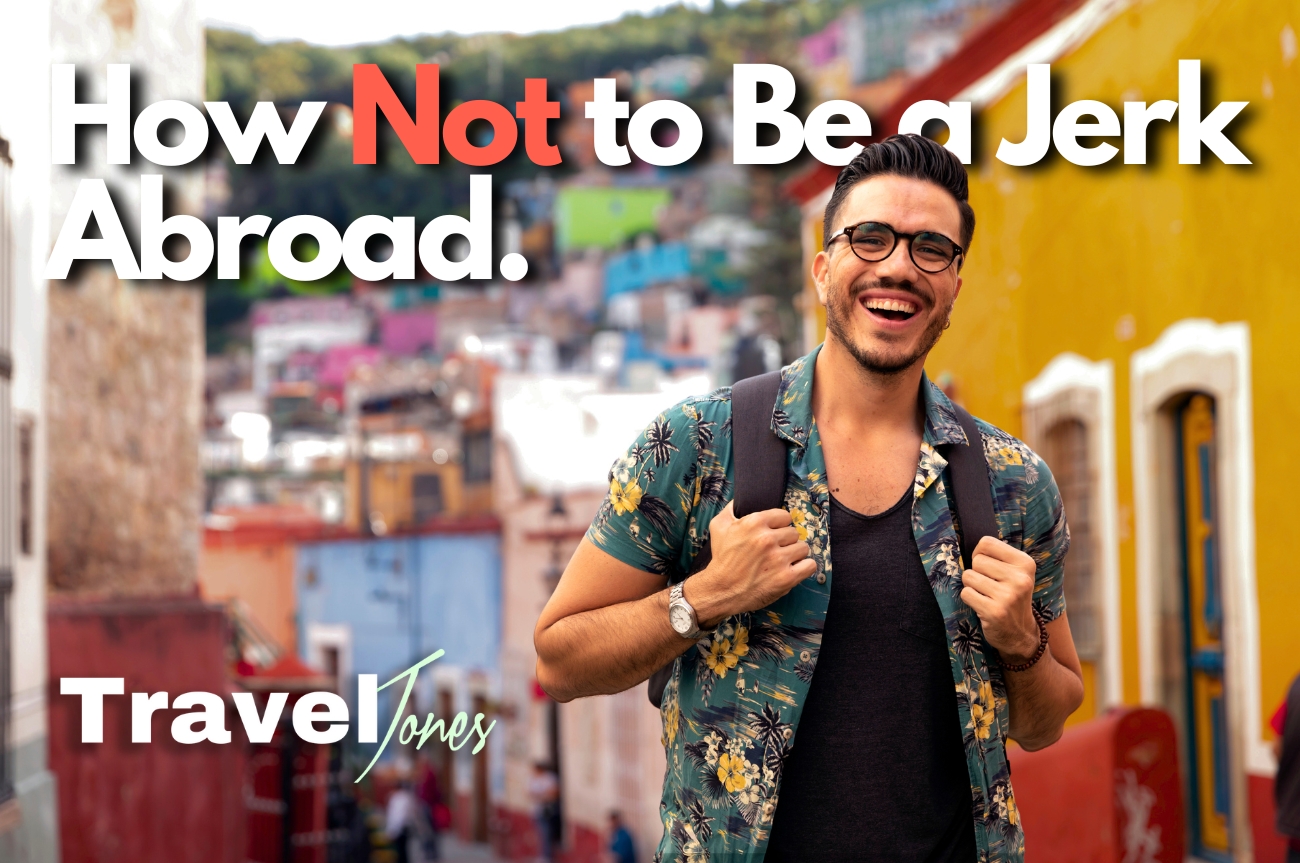 Man with backpack smiling as he travels through a city